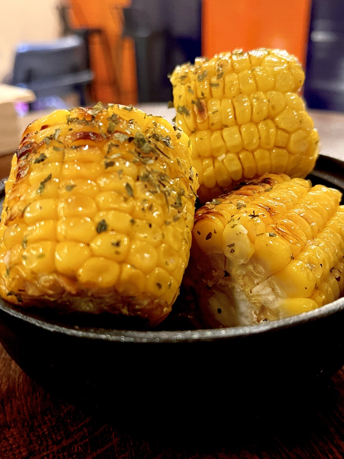Fire-roasted corn finished with herb butter