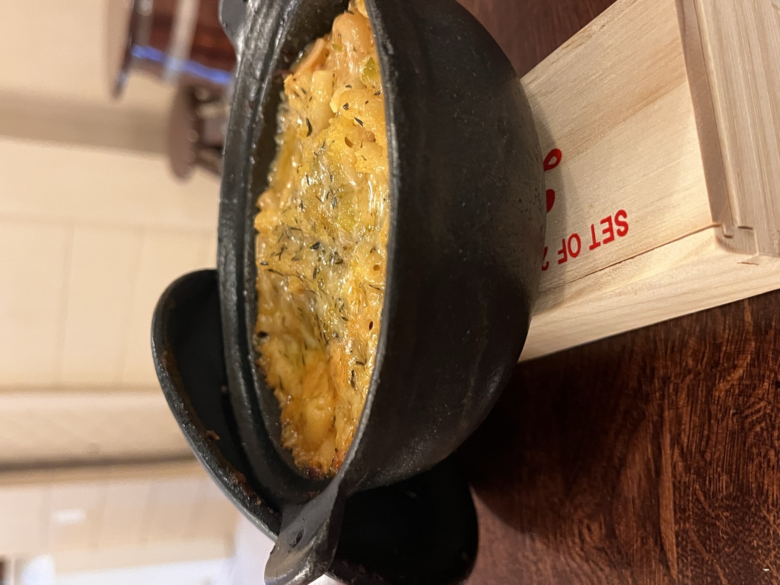Baked macaroni pie in a cast iron pot